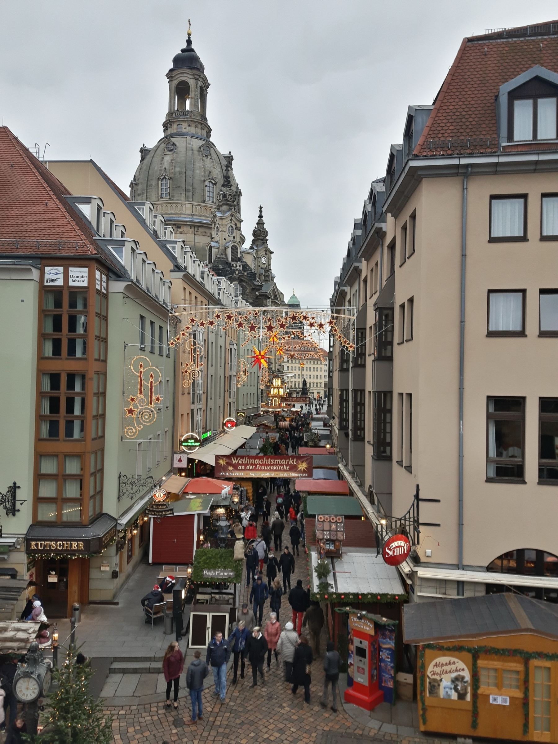 The Christmas market on Münzgasse in Dresden, with the Frauenkirche behind.