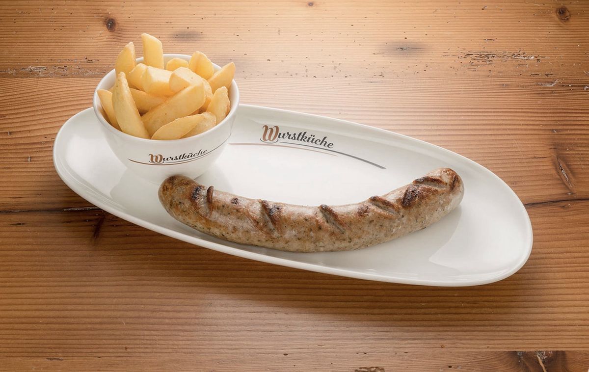A grilled sausage with fries on a plate.