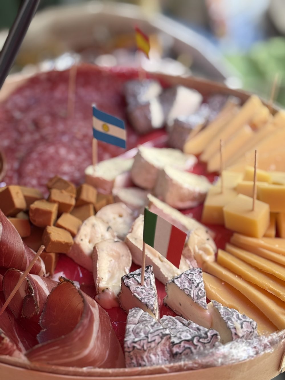 A shared board of Bavarian cheese and cured meats.